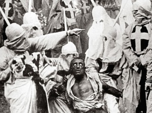 The Birth of a Nation (1915) Directed by D.W. Griffith Shown: Walter Long (as Gus) surrounded by Ku Klux Klan members
